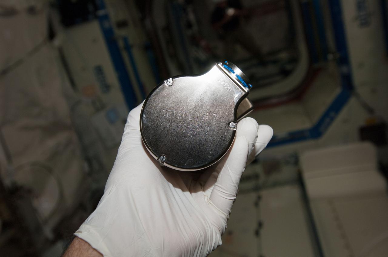 iss038e045758 (2/12/2014) --- A view of Columnar-to-Equiaxed Transition in Solidification Processing-2 (CETSOL-2) test sample 7 which is to be installed into the Material Science Laboratory (MSL) Solidification and Quench Furnace (SQF). This investigation aims to deepen the understanding of the physical principles that govern solidification processes in metal alloys. The patterns of the crystals resulting from transitions of liquids to solids is important for processes used to produce materials such as solar cells, thermoelectrics, and metal alloys.