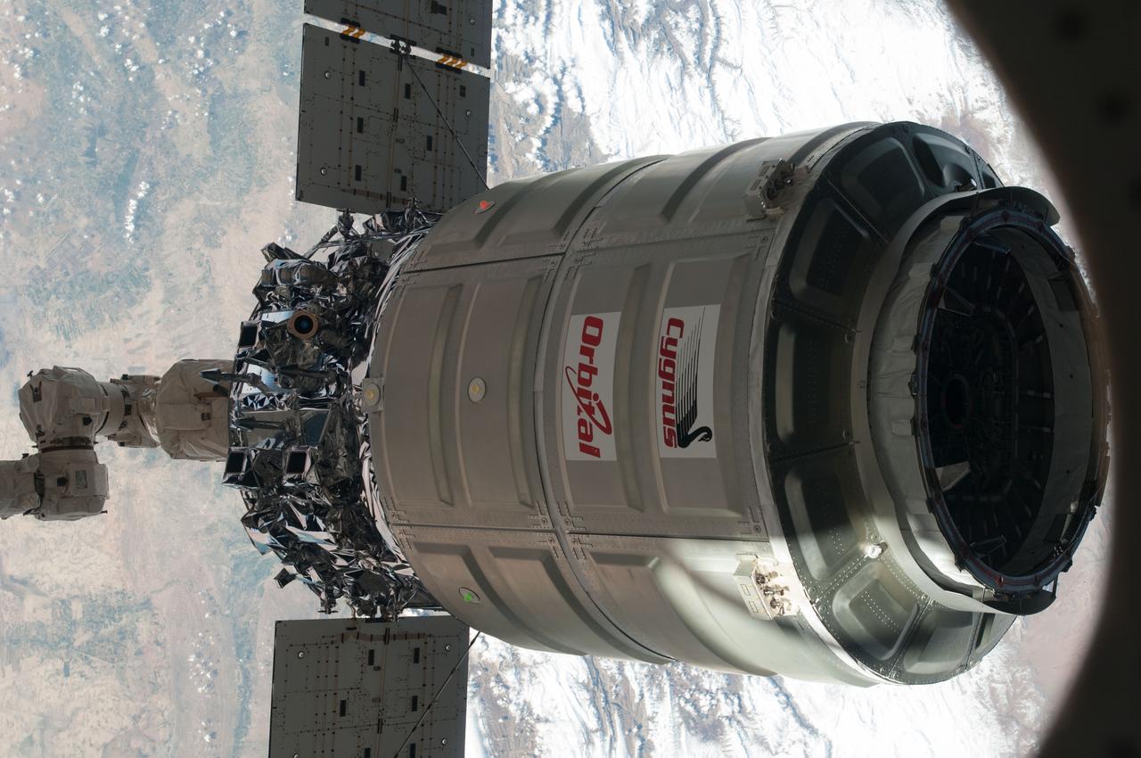 ISS038-E-049447 (18 Feb. 2014) --- The International Space Station's Canadarm2 unberths the Orbital Sciences Corporation's Cygnus spacecraft after several weeks at the space station. NASA astronaut Mike Hopkins, with assistance from Japan Aerospace Exploration Agency astronaut Koichi Wakata, both Expedition 38 flight engineers, used the station's 57-foot Canadarm2 robotic arm to detach Cygnus from the Earth-facing port of the Harmony node at 5:15 a.m. (EST) on Feb. 18, 2014. While Wakata monitored data and kept in contact with the team at Houston's Mission Control Center, Hopkins released Cygnus from the robotic arm at 6:41 a.m.