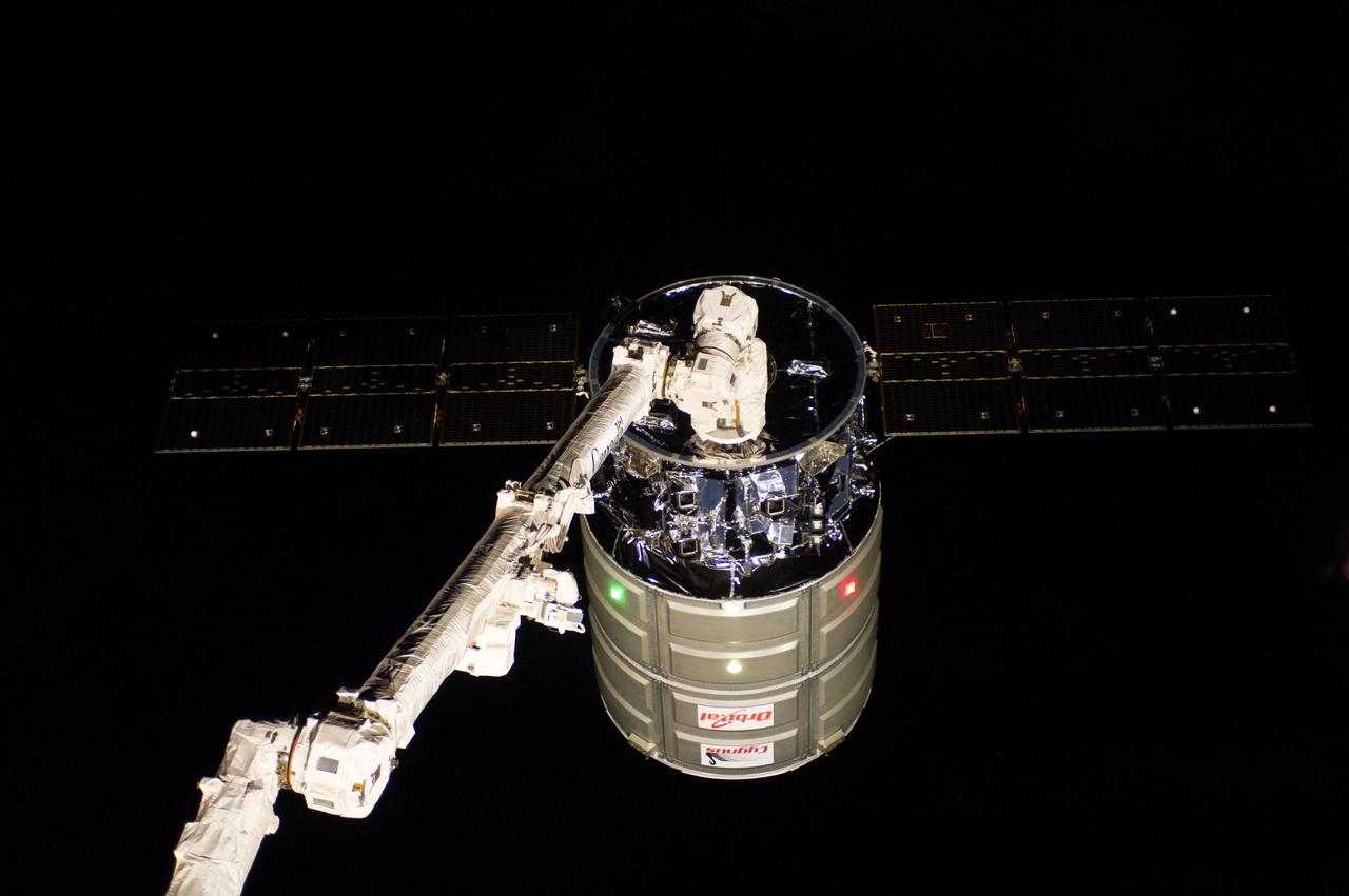 ISS038-E-050062 (18 Feb. 2014) --- The International Space Station's Canadarm2 prepares to release the Orbital Sciences Corporation's Cygnus spacecraft after several weeks at the space station. NASA astronaut Mike Hopkins, with assistance from Japan Aerospace Exploration Agency astronaut Koichi Wakata, both Expedition 38 flight engineers, used the station's 57-foot Canadarm2 robotic arm to detach Cygnus from the Earth-facing port of the Harmony node at 5:15 a.m. (EST) on Feb. 18, 2014. While Wakata monitored data and kept in contact with the team at Houston's Mission Control Center, Hopkins released Cygnus from the robotic arm at 6:41 a.m.
