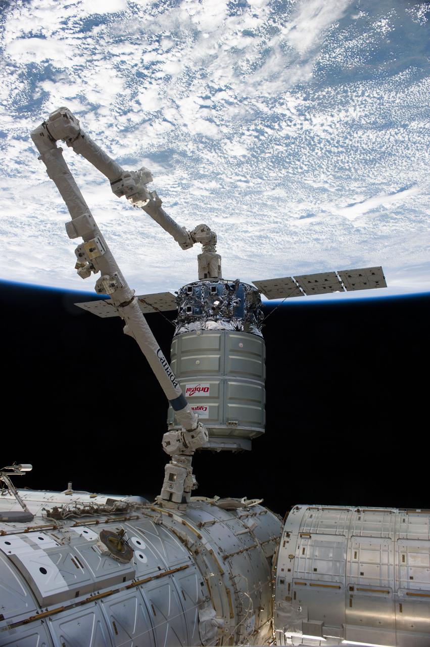 ISS038-E-050734 (18 Feb. 2014) --- The International Space Station's Canadarm2 unberths the Orbital Sciences Corporation's Cygnus spacecraft after several weeks at the space station. NASA astronaut Mike Hopkins, with assistance from Japan Aerospace Exploration Agency astronaut Koichi Wakata, both Expedition 38 flight engineers, used the station's 57-foot Canadarm2 robotic arm to detach Cygnus from the Earth-facing port of the Harmony node at 5:15 a.m. (EST) on Feb. 18, 2014. While Wakata monitored data and kept in contact with the team at Houston's Mission Control Center, Hopkins released Cygnus from the robotic arm at 6:41 a.m. Earth's horizon and the blackness of space provide the backdrop for the scene.