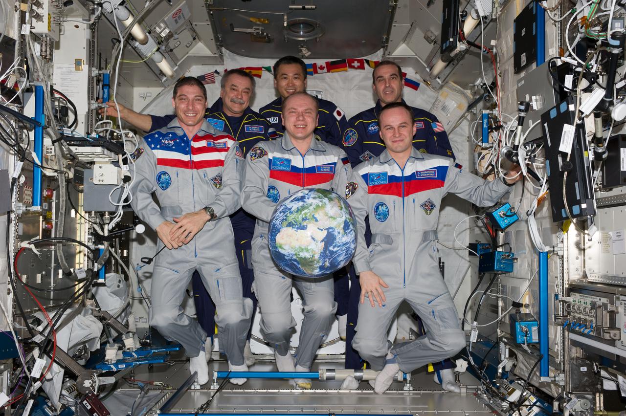 ISS038-E-054944 (22 Feb. 2014) --- Expedition 38 crew members pose for an in-flight crew portrait in the Kibo laboratory of the International Space Station. Pictured on the front row are Russian cosmonaut Oleg Kotov (center), commander; NASA astronaut Mike Hopkins (left) and Russian cosmonaut Sergey Ryazanskiy, both flight engineers. Pictured on the back row (from the left) are Russian cosmonaut Mikhail Tyurin, Japan Aerospace Exploration Agency astronaut Koichi Wakata and NASA astronaut Rick Mastracchio, all flight engineers.