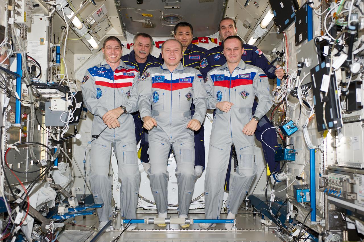 ISS038-E-054961 (22 Feb. 2014) --- Expedition 38 crew members pose for an in-flight crew portrait in the Kibo laboratory of the International Space Station. Pictured on the front row are Russian cosmonaut Oleg Kotov (center), commander; NASA astronaut Mike Hopkins (left) and Russian cosmonaut Sergey Ryazanskiy, both flight engineers. Pictured on the back row (from the left) are Russian cosmonaut Mikhail Tyurin, Japan Aerospace Exploration Agency astronaut Koichi Wakata and NASA astronaut Rick Mastracchio, all flight engineers.
