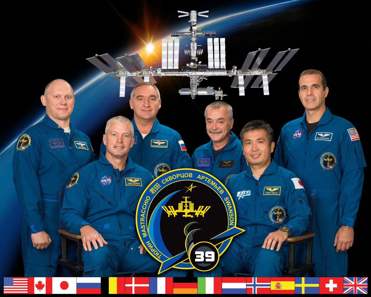 PHOTO DATE: 07-12-13 LOCATION: Bldg. 8, Room 183 - Photo Studio SUBJECT: Official Expedition 39 crew portrait with (Soyuz 37) Mikhail Tyurin, Rick Mastrachhio, Koichi Wakata (JAXA) and (Soyuz 38) Alexander Skvortsov, Oleg Artemyev, Steve Swanson. PHOTOGRAPHER: BILL STAFFORD