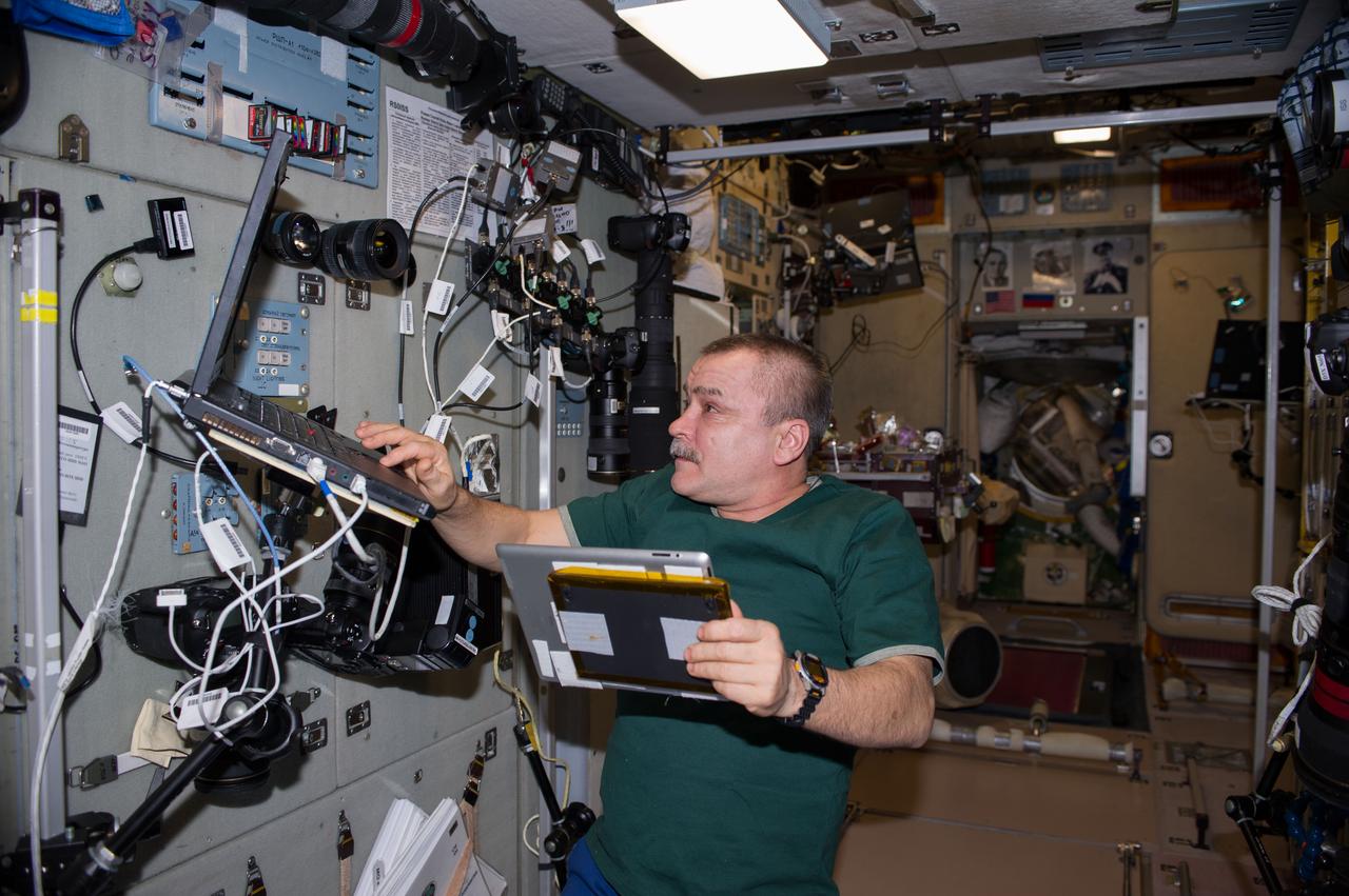 ISS039-E-000027 (11 March 2014) --- In the Zvezda service module of the Earth-orbiting International Space Station, Expedition 39 Flight Engineer Mikhail Tyurin, a cosmonaut with Russia's Federal Space Agency, keeps track of the Soyuz TMA-10M spacecraft as it heads toward Earth with the Expedition 38 crew aboard. Onboard the Soyuz were NASA astronaut Mike Hopkins and cosmonauts Oleg Kotov and Sergey Ryazanskiy who had served 166 days in Earth orbit as members of the Expedition 37 and 38 crews.
