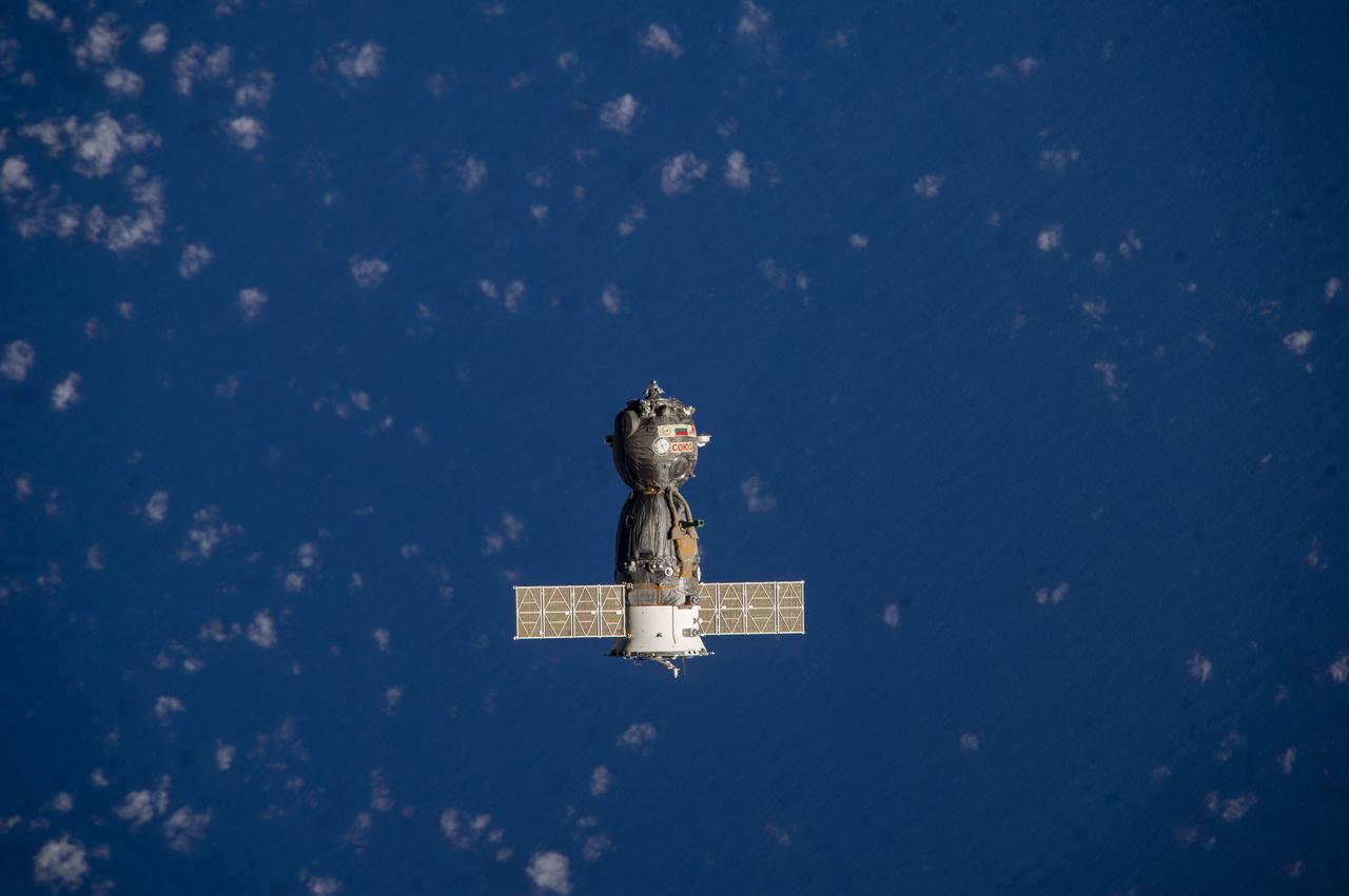 ISS039-E-000067  (11 March 2014) --- As photographed by one of the Expedition 39 crew members aboard the International Space Station, the Soyuz TMA-10M spacecraft heads toward Earth with the Expedition 38 crew aboard. Onboard the Soyuz were NASA astronaut Mike Hopkins and cosmonauts Oleg Kotov and Sergey Ryazanskiy. The trio had served 166 days in Earth orbit as members of the Expedition 37 and 38 crews.