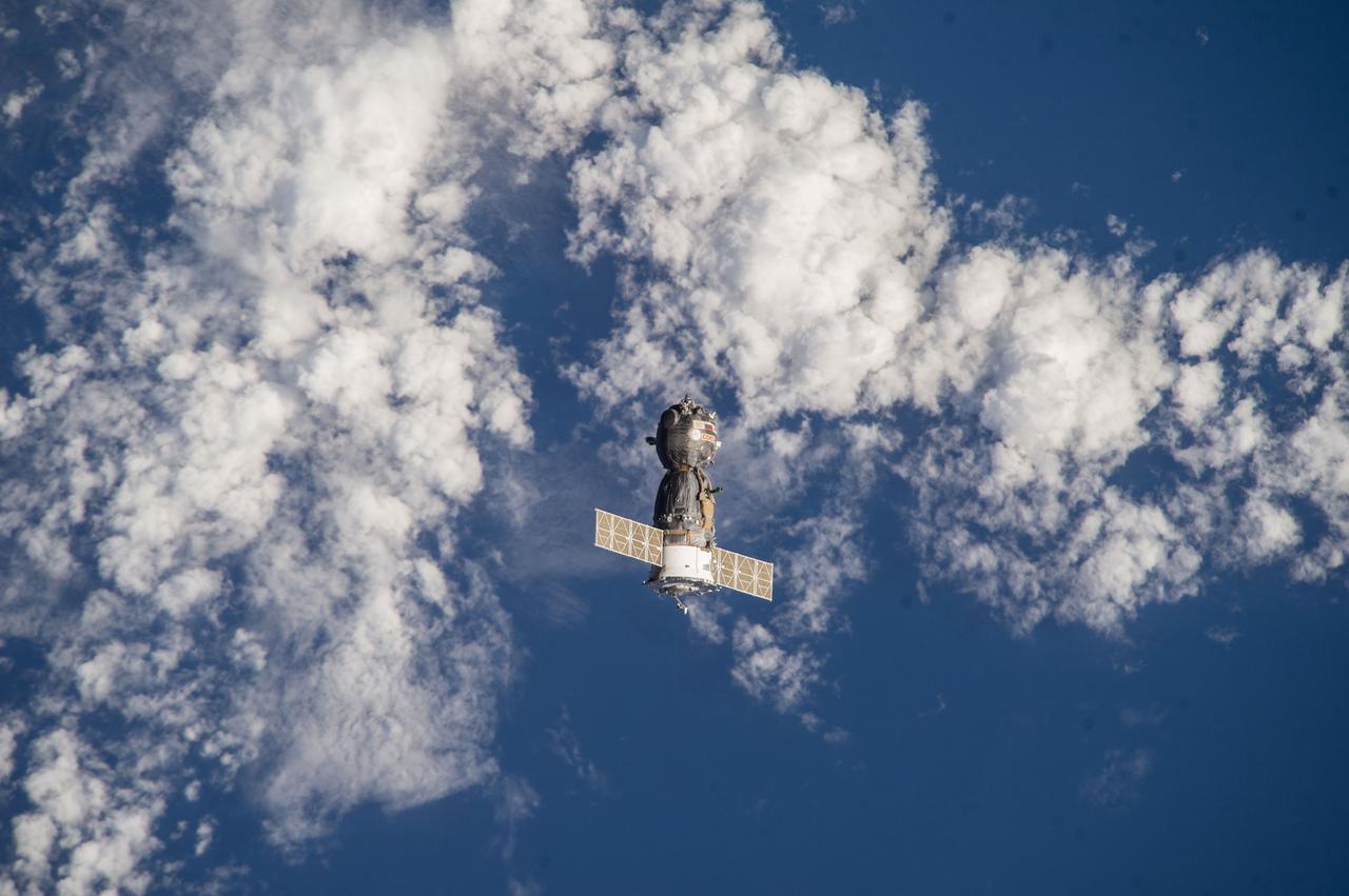 ISS039-E-000169  (11 March 2014) --- As photographed by one of the Expedition 39 crew members aboard the International Space Station, the Soyuz TMA-10M spacecraft heads toward Earth with the Expedition 38 crew aboard. Onboard the Soyuz were NASA astronaut Mike Hopkins and cosmonauts Oleg Kotov and Sergey Ryazanskiy. The trio had served 166 days in Earth orbit as members of the Expedition 37 and 38 crews.