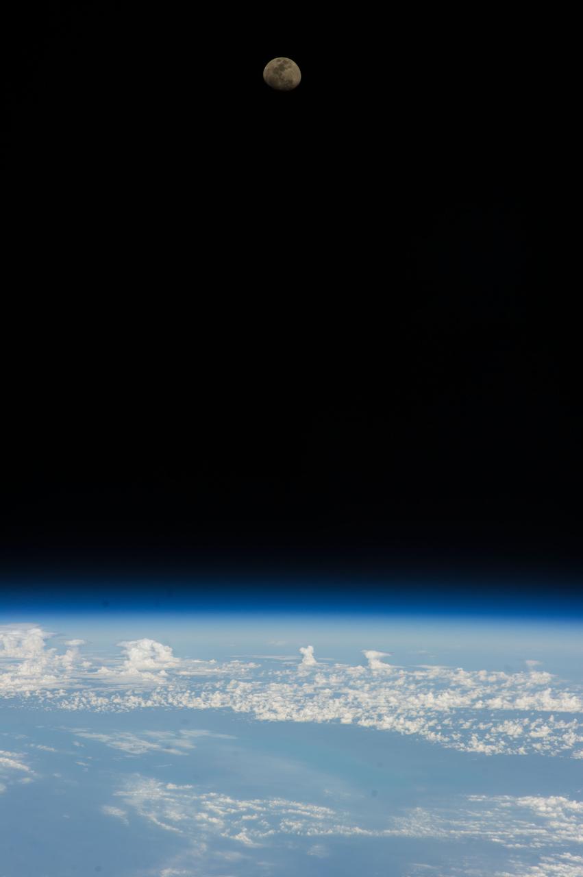Lunar observation taken by the Expedition 39 crew aboard the ISS. An Earth limb and airglow are in view. Image was released by astronaut on Twitter.