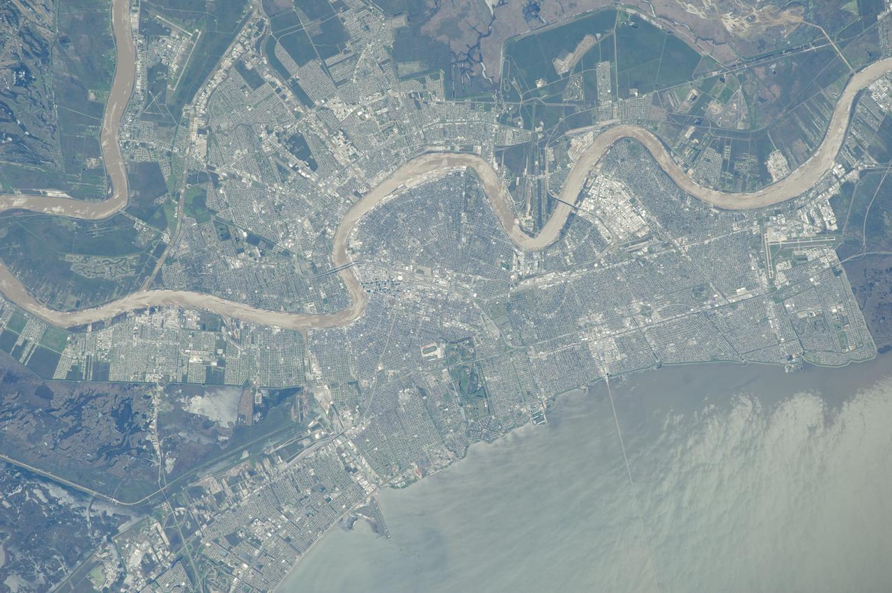 ISS039-E-001640 (13 March 2014) --- From an astronaut's point of view in Earth orbit, it would be difficult to miss the Mississippi River as it meanders through the city of New Orleans. Sunglint on Lake Pontchartrain is visible at lower right in the 400mm image, photographed by one of the Expedition 39 crew members aboard the International Space Station on March 13, 2014.