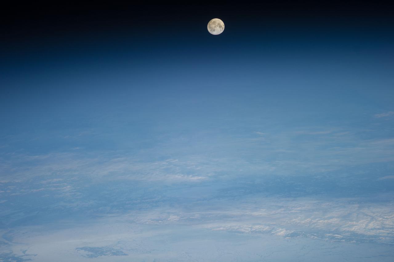 Lunar observation taken during moonset by the Expedition 39 crew aboard the ISS. Earth and airglow are in view. Image was released by astronaut on Twitter.