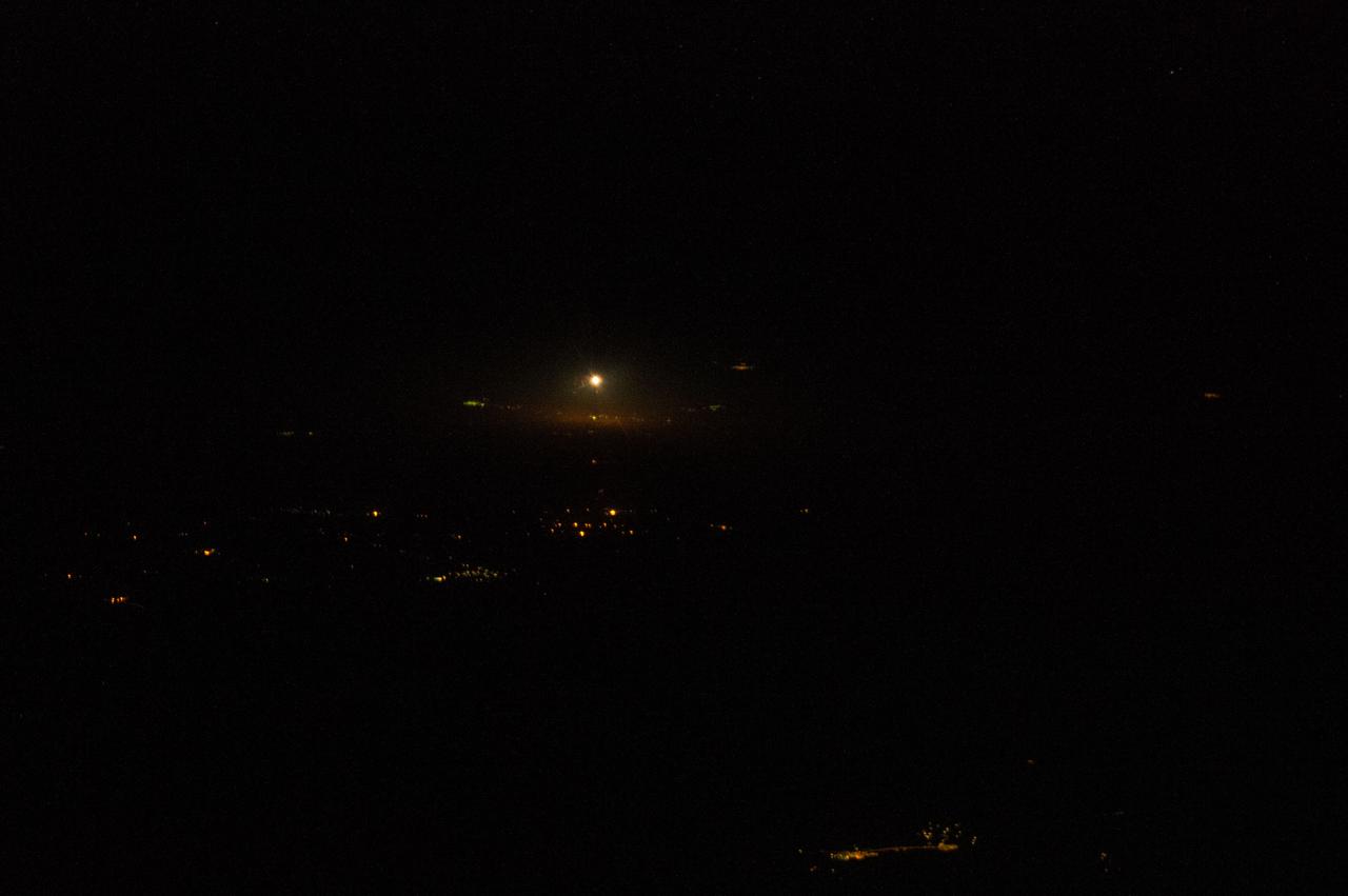 Nighttime view of the launch of the Soyuz TMA-12M spacecraft as seen by Expedition 39 crewmembers aboard the ISS.
