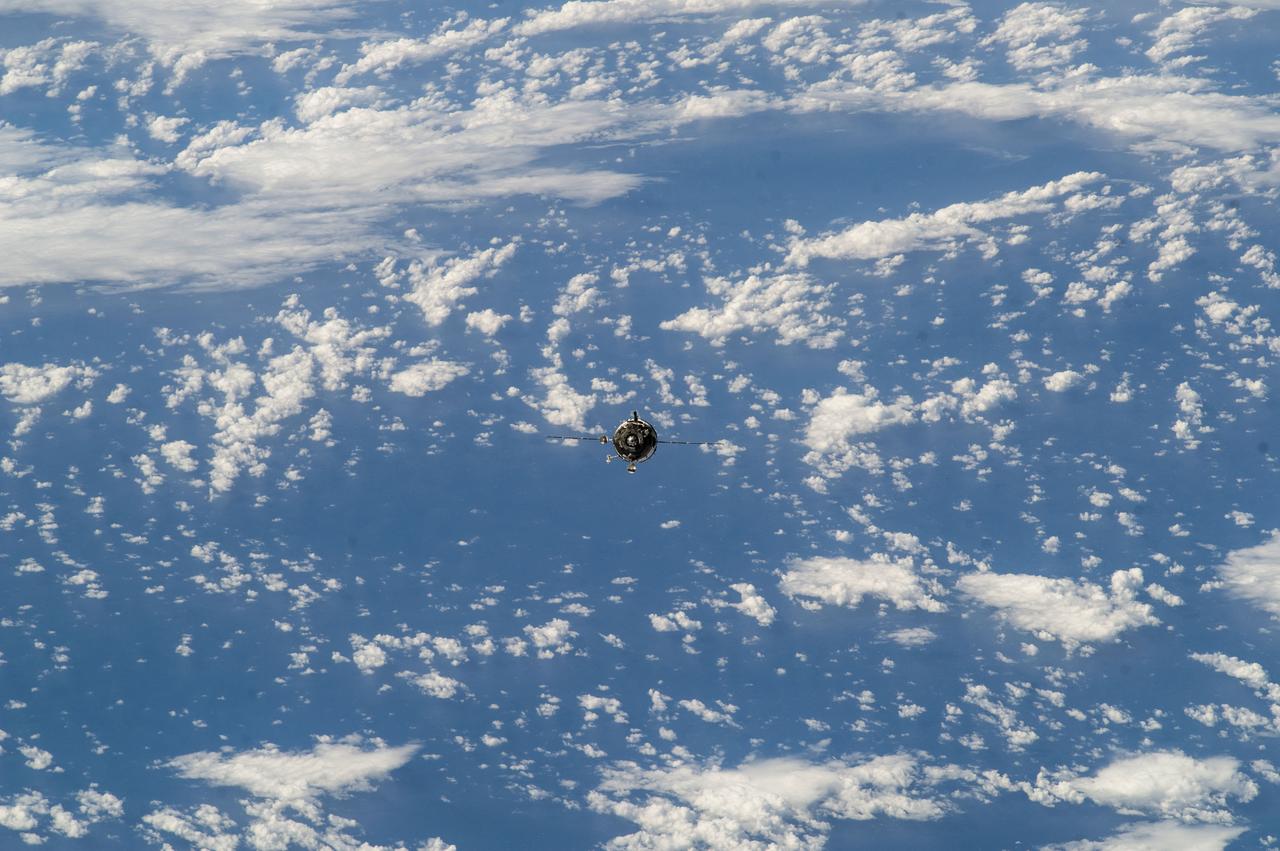 ISS039-E-005632 (27 March 2014) --- A distant view from the International Space Station shows the Soyuz TMA-12M spacecraft as a tiny item at frame center shortly before docking of the two orbiting vehicles. Onboard the Soyuz at this time were incoming Expedition 39 crew members -- Soyuz Commander Alexander Skvortsov of the Russian Federal Space Agency (Roscosmos) Flight Engineer Steve Swanson of NASA and Flight Engineer Oleg Artemyev of Roscosmos.  Onboard the orbiting complex were Expedition 39 Commander Koichi Wakata of the Japan Aerospace Exploration Agency (JAXA), Flight Engineer Rick Mastracchio of NASA and Flight Engineer Mikhail Tyurin of Roscosmos.