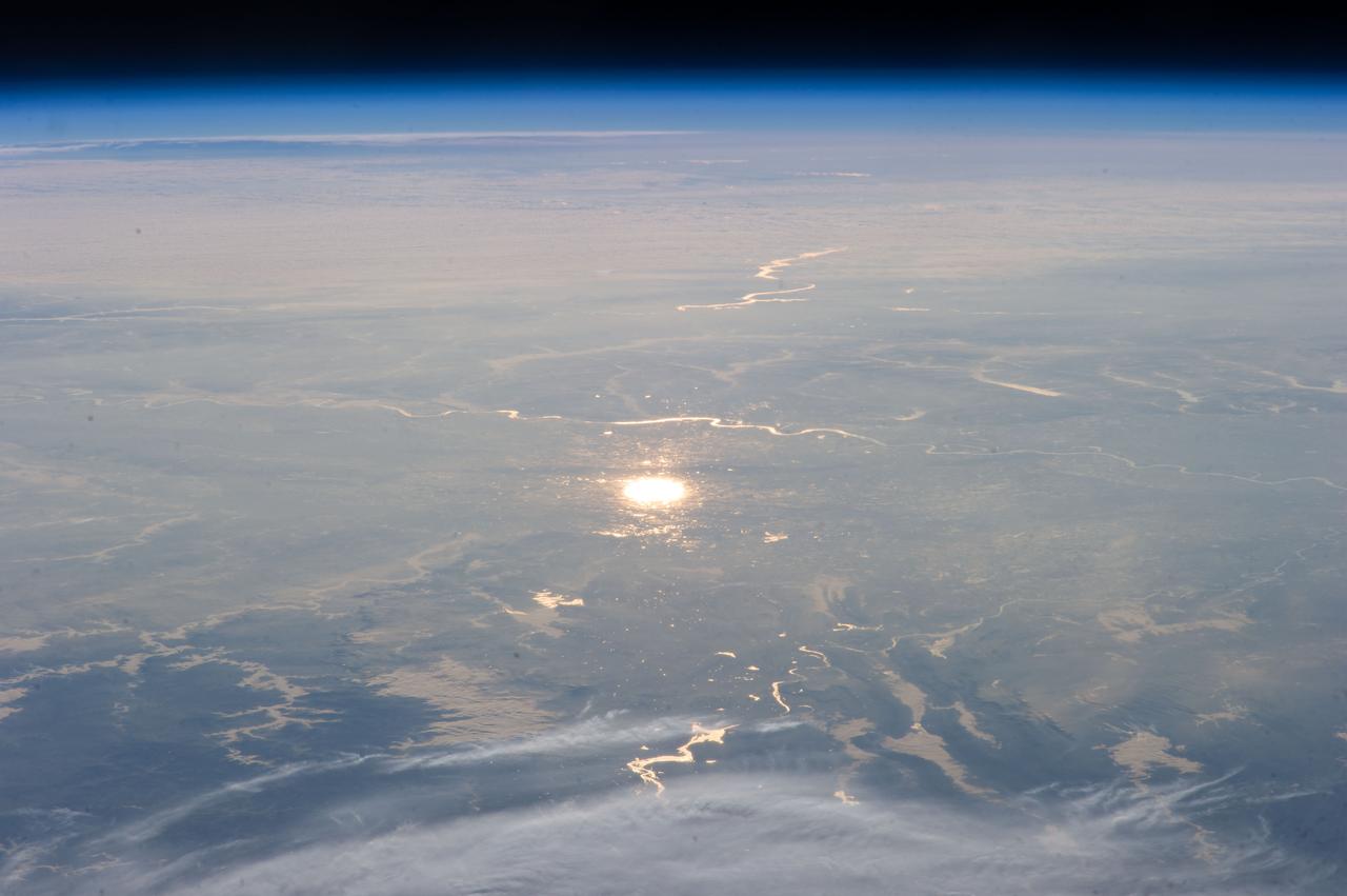 Earth observation taken by the Expedition 39 crew aboard the ISS. Image was released by astronaut on Twitter and downlinked in folder: sun glint.