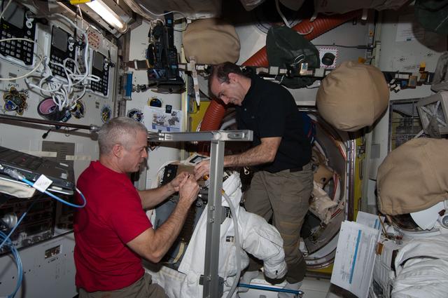 NASA image: Swanson and Mastracchio conduct EMU FPS Remove and Replace OPS