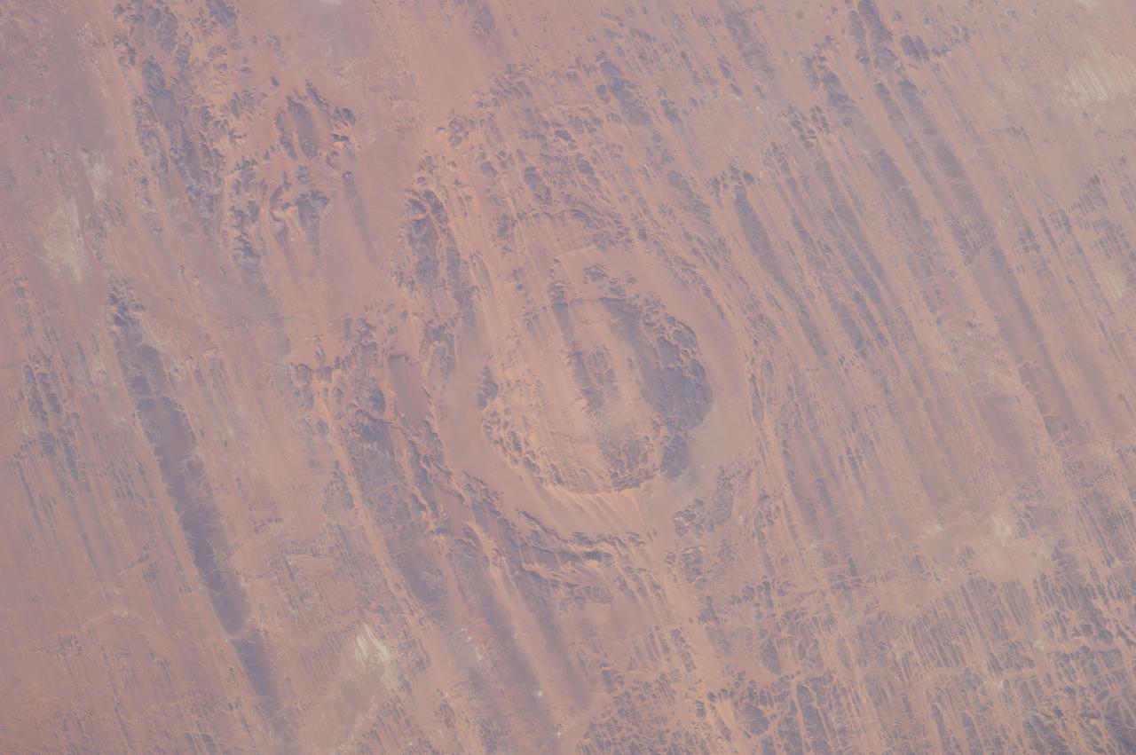 Earth observation taken by the Expedition 39 crew aboard the ISS. Image was released by astronaut on Twitter and downlinked in folder: Aorounga Impact Crater, Chad.
