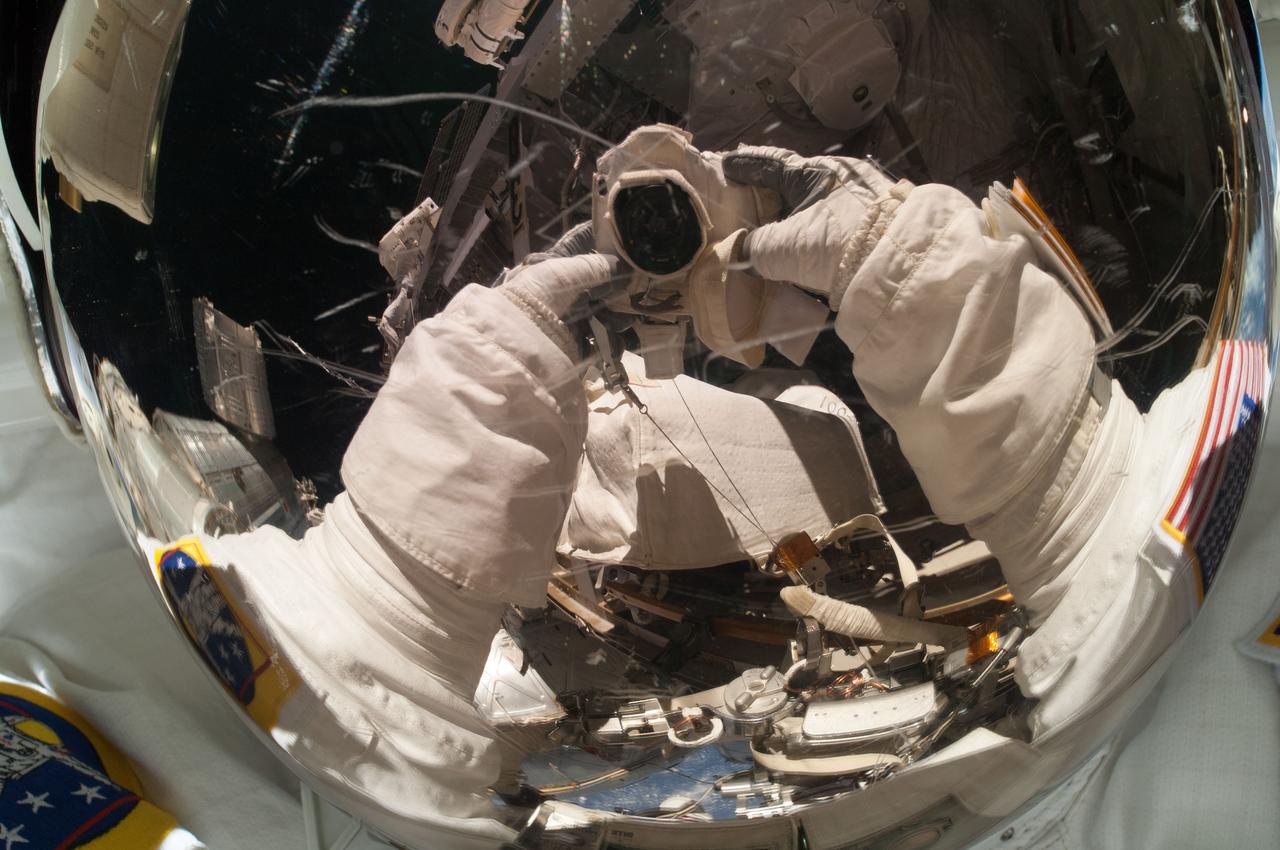 ISS039-E-014878 (22 April 2014) --- Part of the upper body of NASA astronaut Rick Mastracchio is pictured in a "selfie" or self-portrait during a spacewalk to replace a failed backup computer relay box in the S0 truss of the International Space Station on April 22, 2014.  He was accompanied on the spacewalk by fellow Flight Engineer Steve Swanson of NASA.