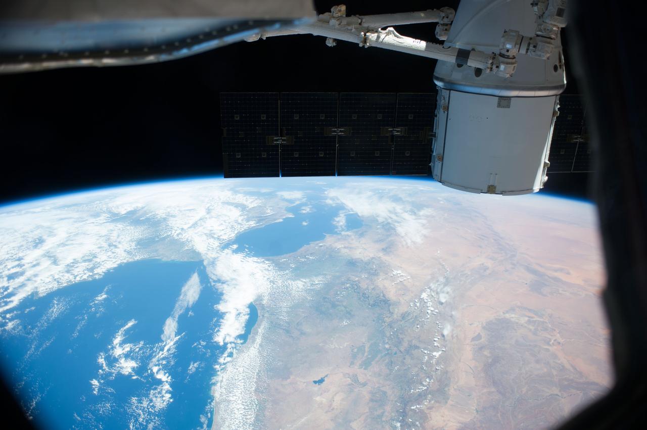Earth observation taken by the Expedition 39 crew aboard the ISS. A portion of the SpaceX Dragon Commercial Resupply Services-3 (CRS-3) spacecraft is in view. Image was released by astronaut on Twitter and downlinked in folder: Europe.
