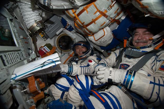 NASA image: Wakata and Tyurin during Sokol Leak Check