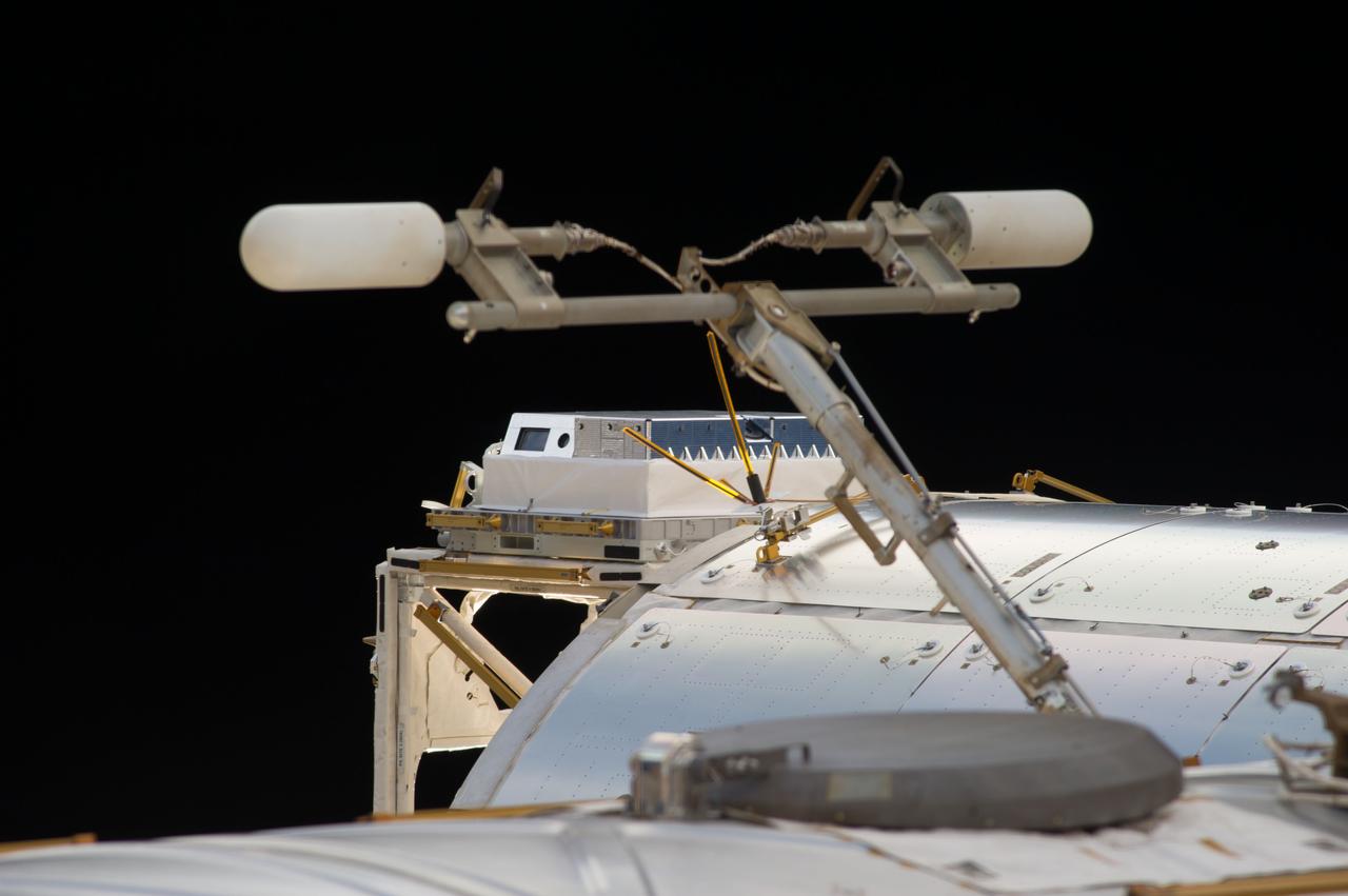 View of the High Definition Earth Viewing (HDEV) flight assembly installed on the exterior of the Columbus European Laboratory module. Image was released by astronaut on Twitter. The High Definition Earth Viewing (HDEV) experiment places four commercially available HD cameras on the exterior of the space station and uses them to stream live video of Earth for viewing online.  The cameras are enclosed in a temperature specific housing and are exposed to the harsh radiation of space.  Analysis of the effect of space on the video quality, over the time HDEV is operational, may help engineers decide which cameras are the best types to use on future missions. High school students helped design some of the cameras' components, through the High Schools United with NASA to Create Hardware (HUNCH) program, and student teams operate the experiment.