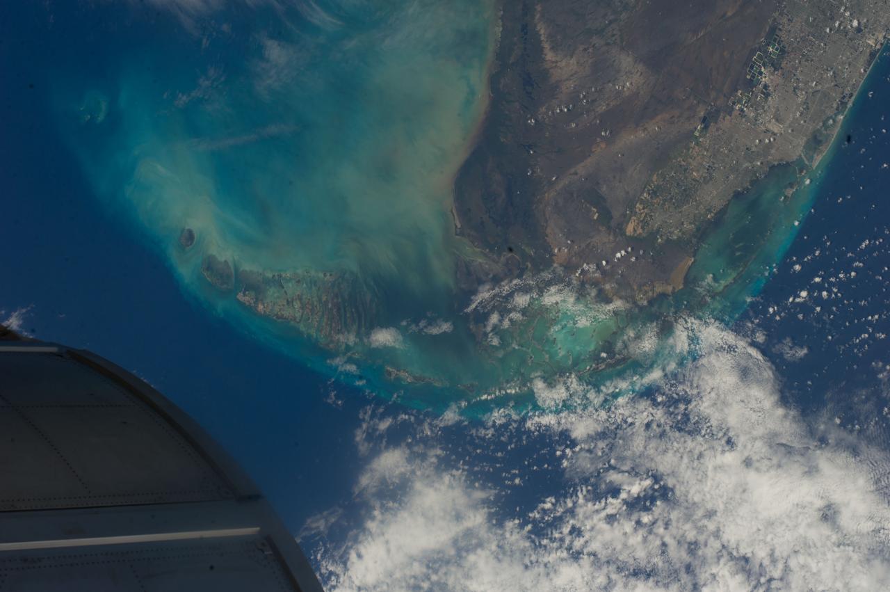 ISS040-E-000467 (17 May 2014) --- One of the Expedition 40 crew members aboard the International Space Station photographed this image of southern Florida, featuring Miami, the Everglades and the Florida Keys, on May 17, 2014. The object in lower left is part of one of the modules on the orbital outpost.