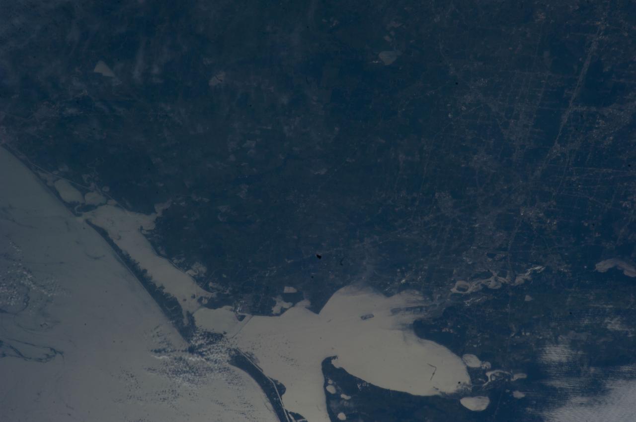 ISS040-E-005979 (29 May 2014) --- One of the Expedition 40 crew members aboard the International Space Station used a 200mm lens to photograph this image from 222 nautical miles above Earth showing Harris County and Galveston County, Texas plus several other surrounding counties, including a long stretch along the Gulf of Mexico (bottom left). The entirety of Galveston Bay is visible at bottom center.  Just below center lies the 1625-acre site of NASA's Johnson Space Center, one of the training venues for all space station crew members and the nearby long-time area of residence for NASA astronauts.