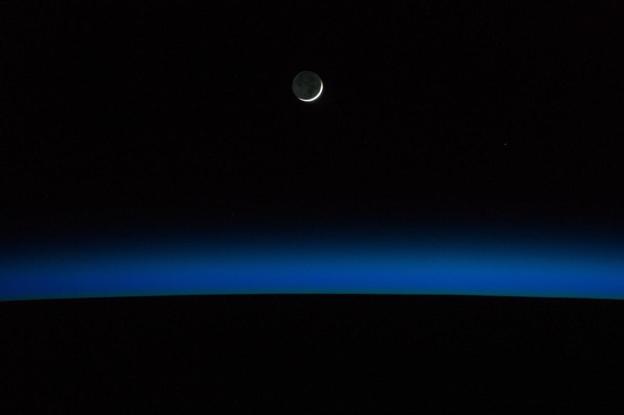 ISS040-E-005986 (30 May 2014) --- A crescent moon and Earth's horizon are featured in this nighttime image photographed by an Expedition 40 crew member on the International Space Station.