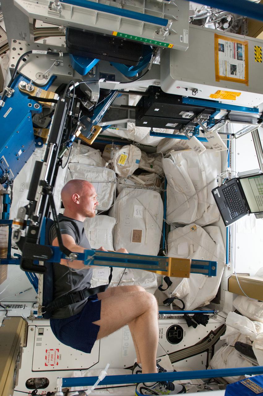 ISS040-E-006102 (31 May 2014) --- European Space Agency astronaut Alexander Gerst, Expedition 40 flight engineer, gets a workout on the advanced Resistive Exercise Device (aRED) in the Tranquility node of the International Space Station.