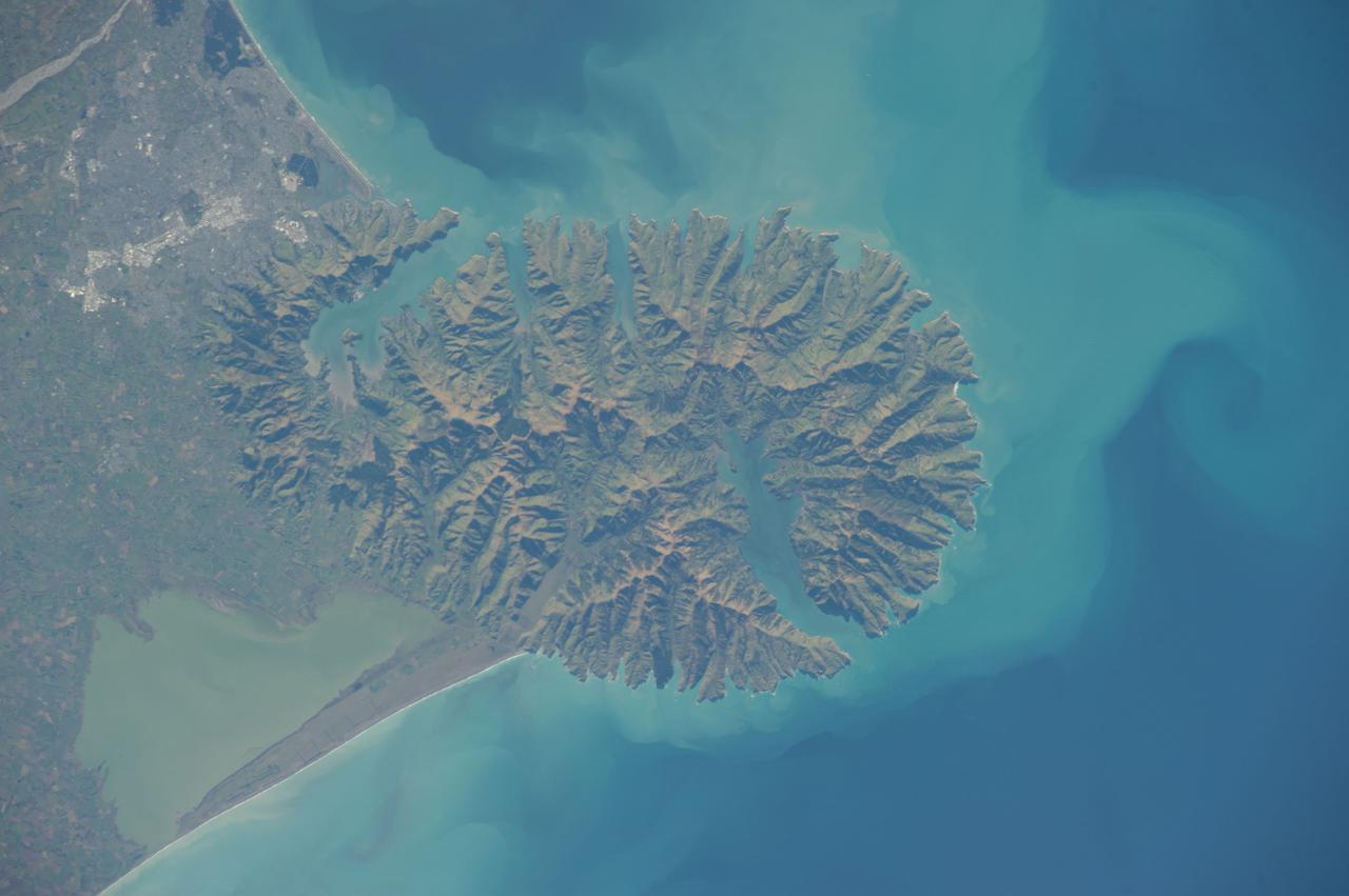 ISS040-E-006165 (31 May 2014 ) --- One of the Expedition 40 crew members aboard the International Space Station photographed this nadir image of the volcanic-born Banks Peninsula, on the east coast of the South Island of New Zealand on May 31, 2014.  Banks Peninsula covers an area of approximately 1,150 square kilometers.
