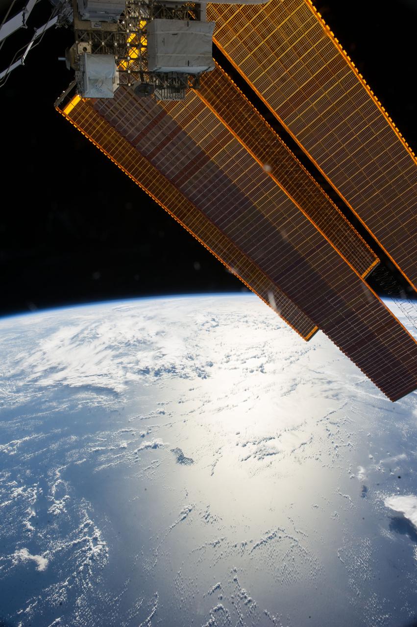 ISS040-E-006252 (30 May 2014) --- Solar array panels and Earth’s horizon are featured in this image photographed by an Expedition 40 crew member on the International Space Station.