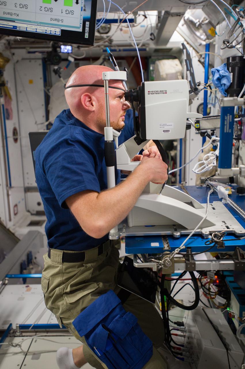 ISS040-E-006738 (3 June 2014) --- In the International Space Station's Harmony node, European Space Agency astronaut Alexander Gerst, Expedition 40 flight engineer, performs an eye exam for the Ocular Health experiment which observes and seeks to understand vision changes during long-term space missions.