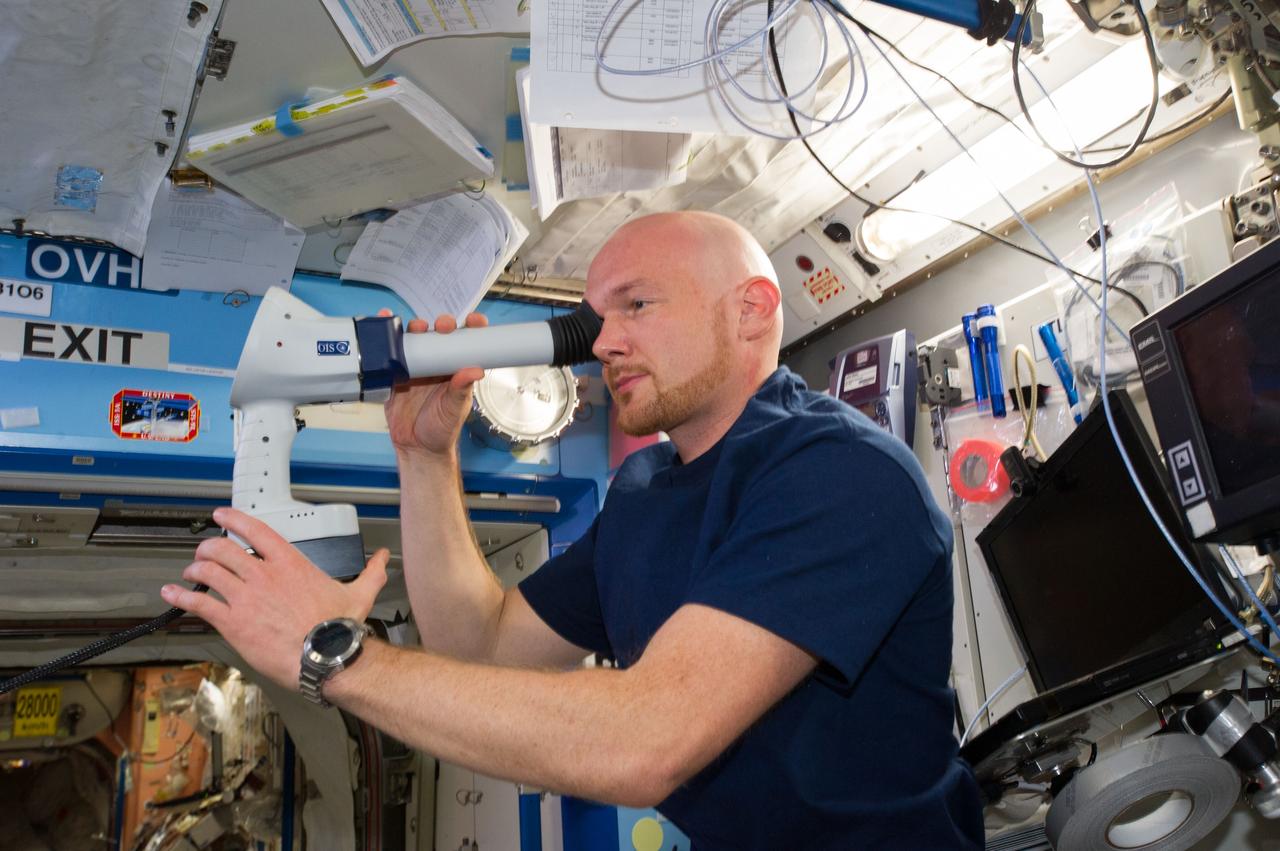 ISS040-E-006897 (3 June 2014) --- European Space Agency astronaut Alexander Gerst, Expedition 40 flight engineer, performs an Ocular Health (OH) examination in the Destiny laboratory of the International Space Station.