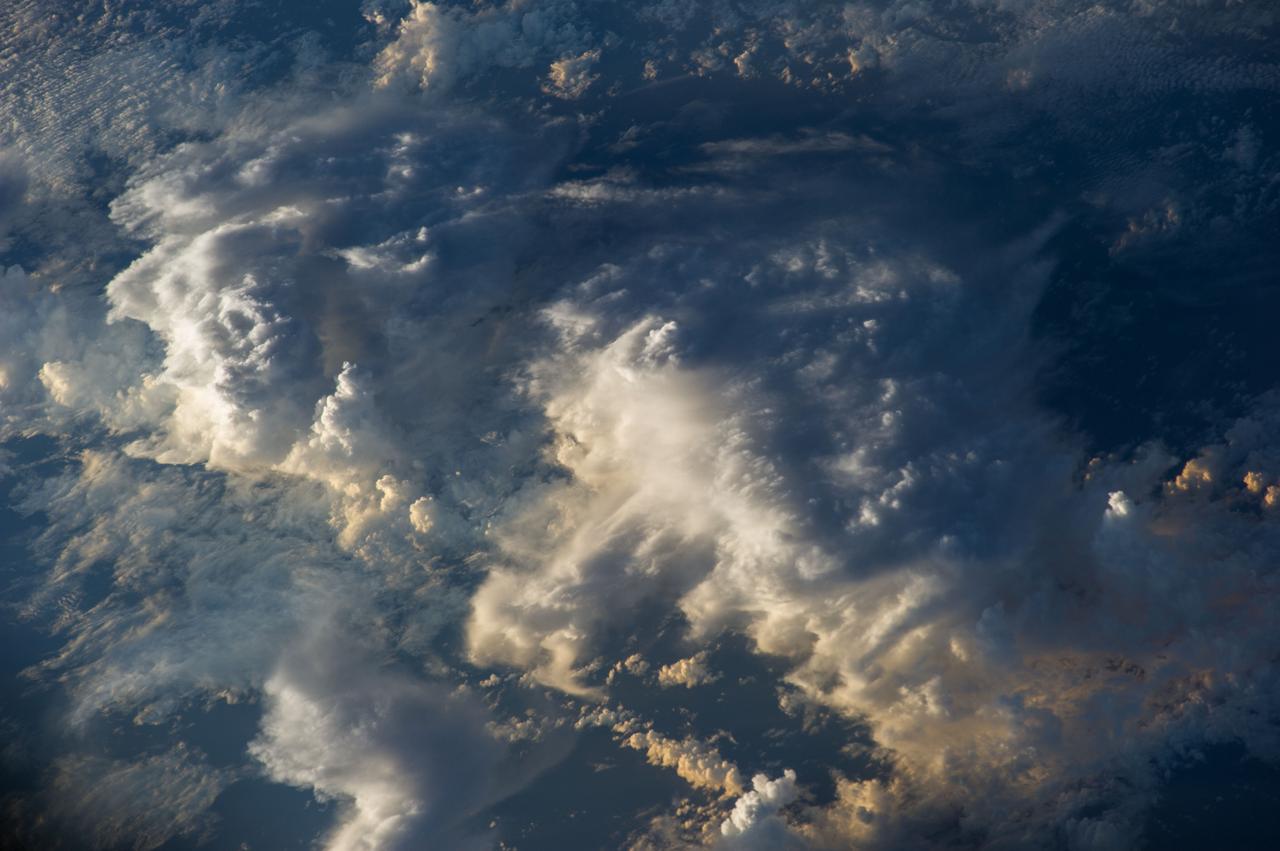 Earth Observation taken during a day pass by the Expedition 40 crew aboard the International Space Station (ISS). Folder lists this as: Clouds over Tasman Sea.