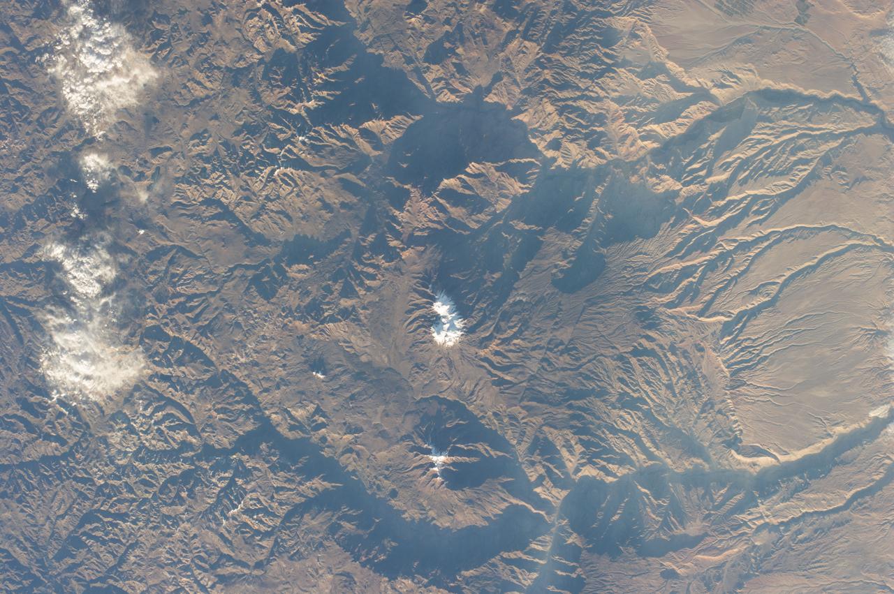 Earth Observation taken during a day pass by the Expedition 40 crew aboard the International Space Station (ISS). Folder lists items in this group as: Chile Atacama Bolivia Andes and active volcano.