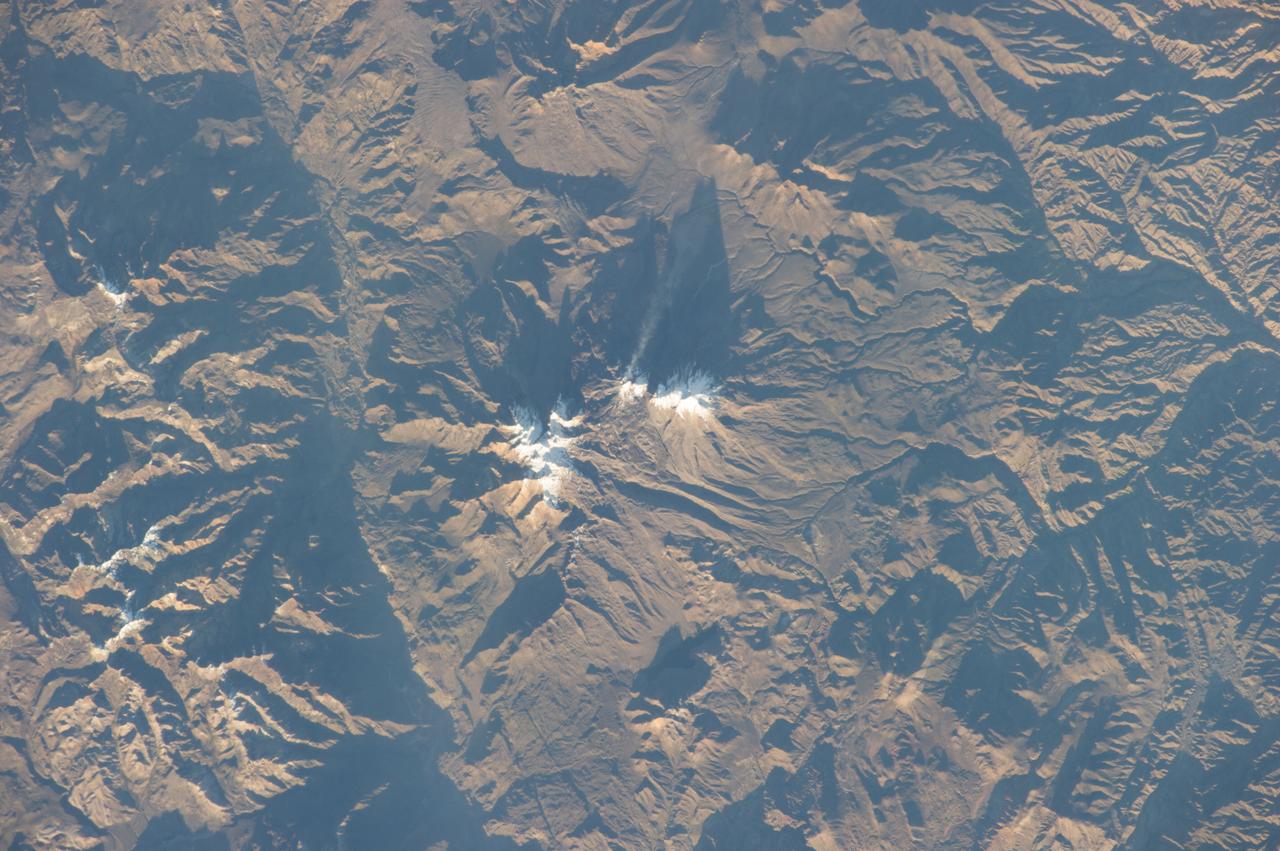 Earth Observation taken during a day pass by the Expedition 40 crew aboard the International Space Station (ISS). Folder lists items in this group as: Chile Atacama Bolivia Andes and active volcano.