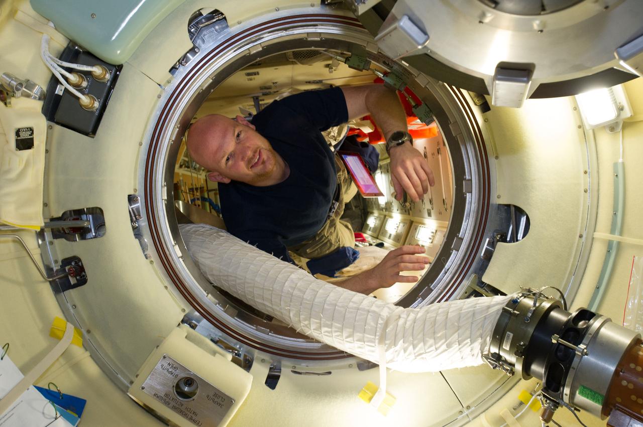 ISS040-E-008036 (6 June 2014) --- European Space Agency astronaut Alexander Gerst, Expedition 40 flight engineer, is pictured in the Rassvet Mini-Research Module 1 (MRM-1) hatch of the International Space Station.