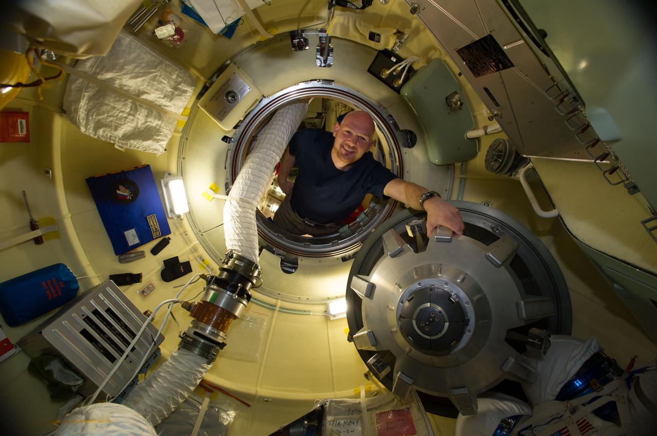 ISS040-E-008044 (6 June 2014) --- European Space Agency astronaut Alexander Gerst, Expedition 40 flight engineer, is pictured in the Rassvet Mini-Research Module 1 (MRM-1) hatch of the International Space Station.