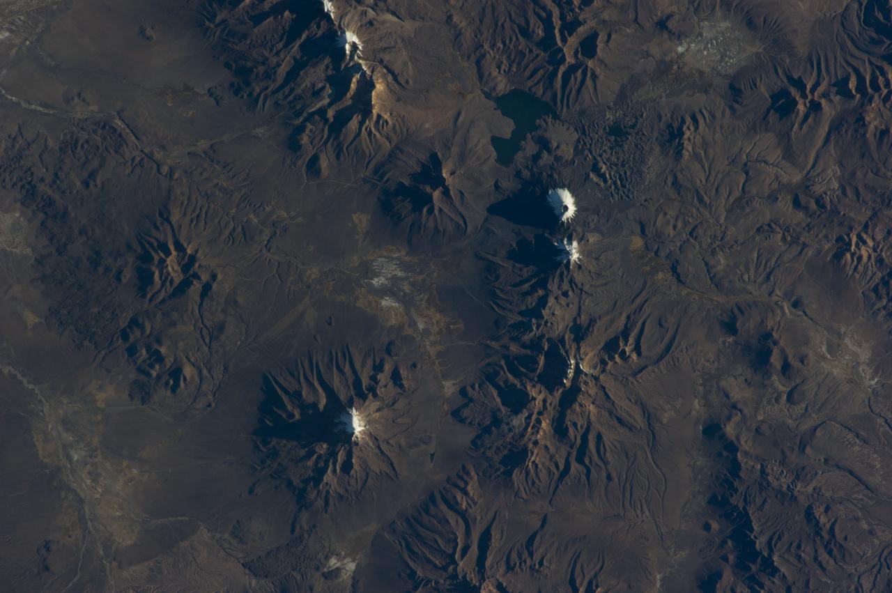 Earth Observation taken during a day pass by the Expedition 40 crew aboard the International Space Station (ISS). Folder lists this as: Chilean volcanos.