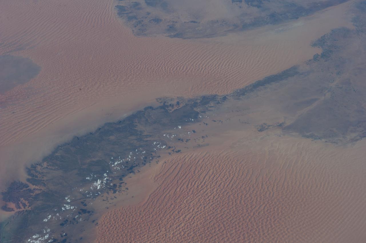 Earth observation taken during a day pass by the Expedition 40 crew aboard the International Space Station. File identifies it as: Sahara, and Libya.