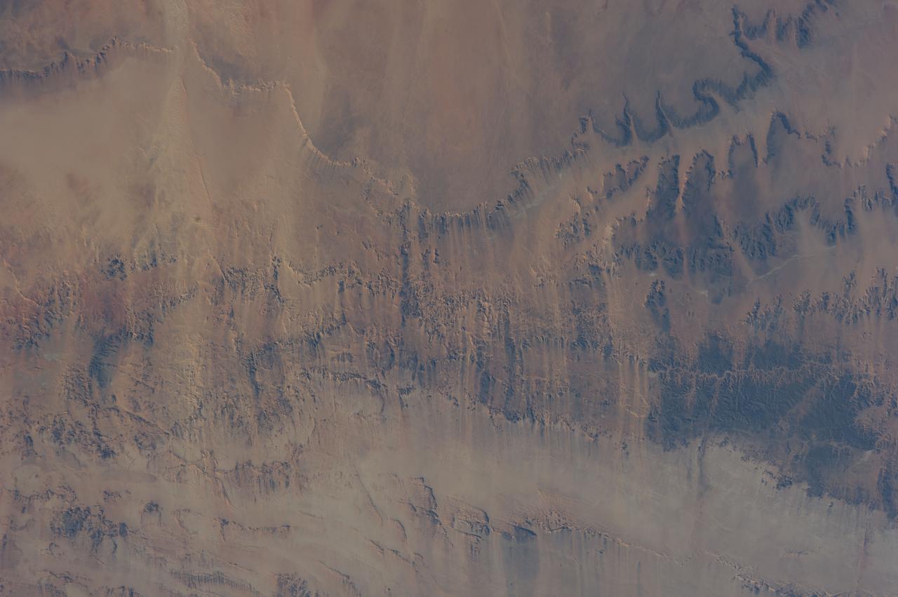 Earth observation taken during a day pass by the Expedition 40 crew aboard the International Space Station. File identifies it as: Sahara, and Libya.