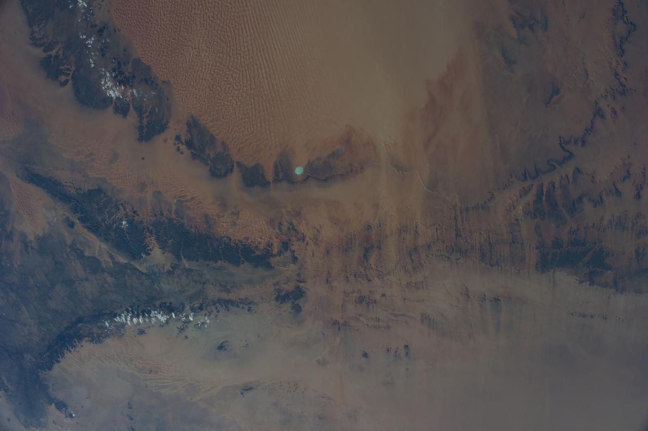 Earth observation taken during a day pass by the Expedition 40 crew aboard the International Space Station. File identifies it as: Sahara, and Libya.