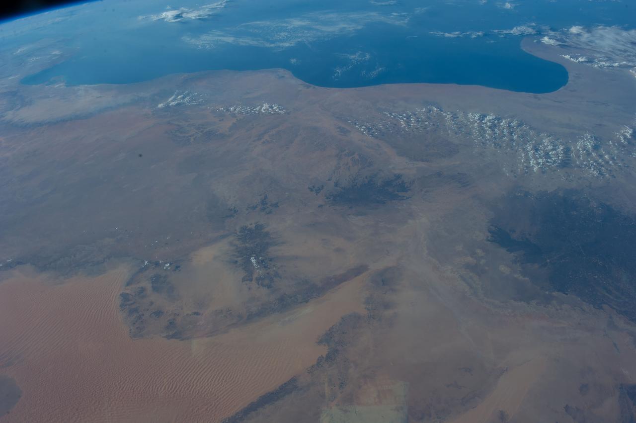 Earth observation taken during a day pass by the Expedition 40 crew aboard the International Space Station. File identifies it as: Sahara, and Libya.