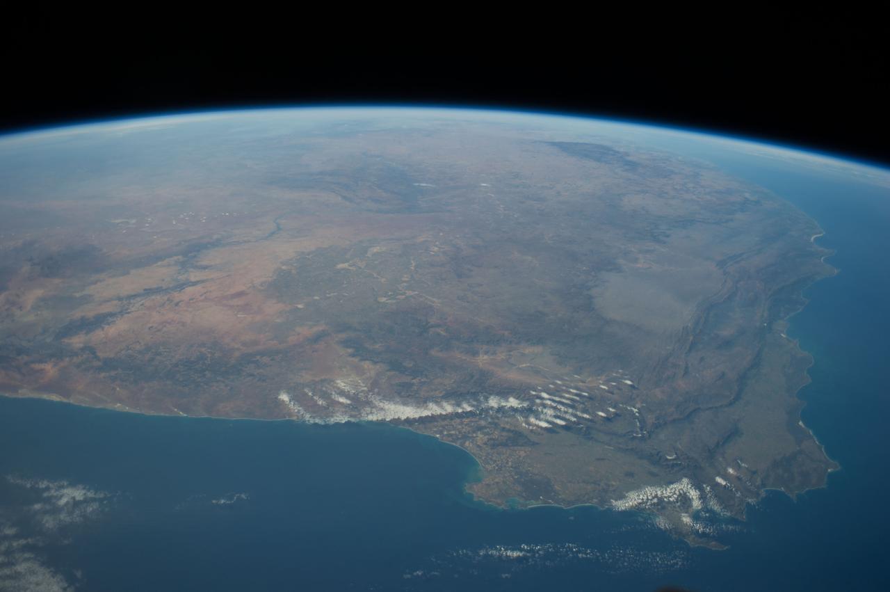 ISS040-E-011049 (13 June 2014) --- One of the Expedition 40 crew members aboard the International Space Station photographed this panoramic scene of South Africa and Lesotho on June 13. In the easterly-looking view, Capetown can easily be delineated near bottom center. The country of Lesotho -- one of only three nations in the world which are landlocked and totally surrounded by a single country -- is near the lava plateau at top right.
