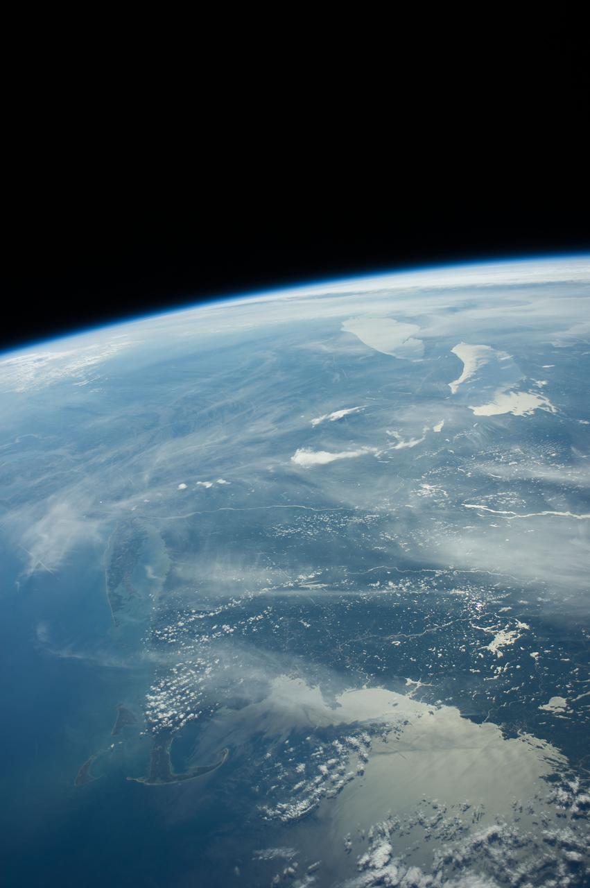 Earth Observation taken during a day pass by the Expedition 40 crew aboard the International Space Station (ISS). Folder lists this as: US East Coast, sun glint, Cape Cod, NY, DC, Great Lakes.