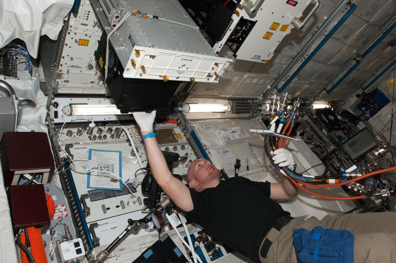 ISS040-E-014865 (18 June 2014) --- European Space Agency astronaut Alexander Gerst, Expedition 40 flight engineer, works with Fundamental and Applied Studies of Emulsion Stability (FASES) experiment hardware in the Columbus laboratory of the International Space Station. The emulsion study sponsored by ESA and located inside the Columbus laboratory Fluids Science Laboratory could lead to environmentally friendly products with industrial and space applications.