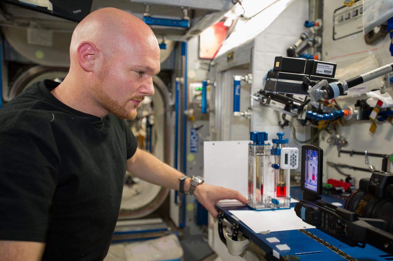 ISS040-E-015523 (19 June 2014) --- European Space Agency astronaut Alexander Gerst, Expedition 40 flight engineer, conducts a session with the Capillary Flow Experiment (CFE-2) in the Harmony node of the International Space Station. CFE is a suite of fluid physics experiments that investigate how fluids behave in microgravity which could benefit water and fuel delivery systems on future spacecraft. Scientists designed the CFE-2 to study properties of fluids and bubbles inside containers with a specific 3-D geometry.
