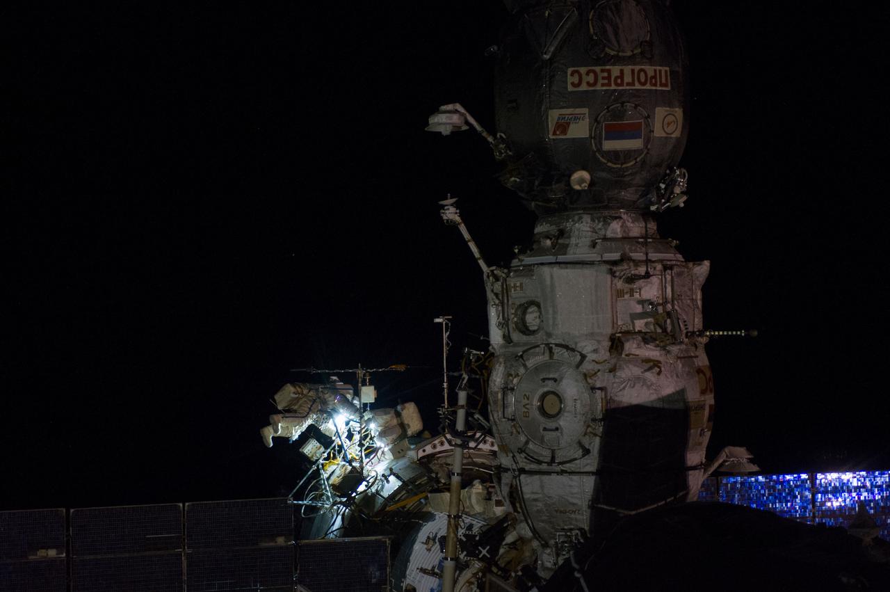 ISS040-E-015569 (19 June 2014) --- Russian cosmonauts Alexander Skvortsov (right) and Oleg Artemyev, both Expedition 40 flight engineers, participate in a session of extravehicular activity (EVA) as work continues on the International Space Station. During the seven-hour, 23-minute spacewalk Skvortsov and Artemyev completed installation and experiment tasks outside the station’s Russian segment.