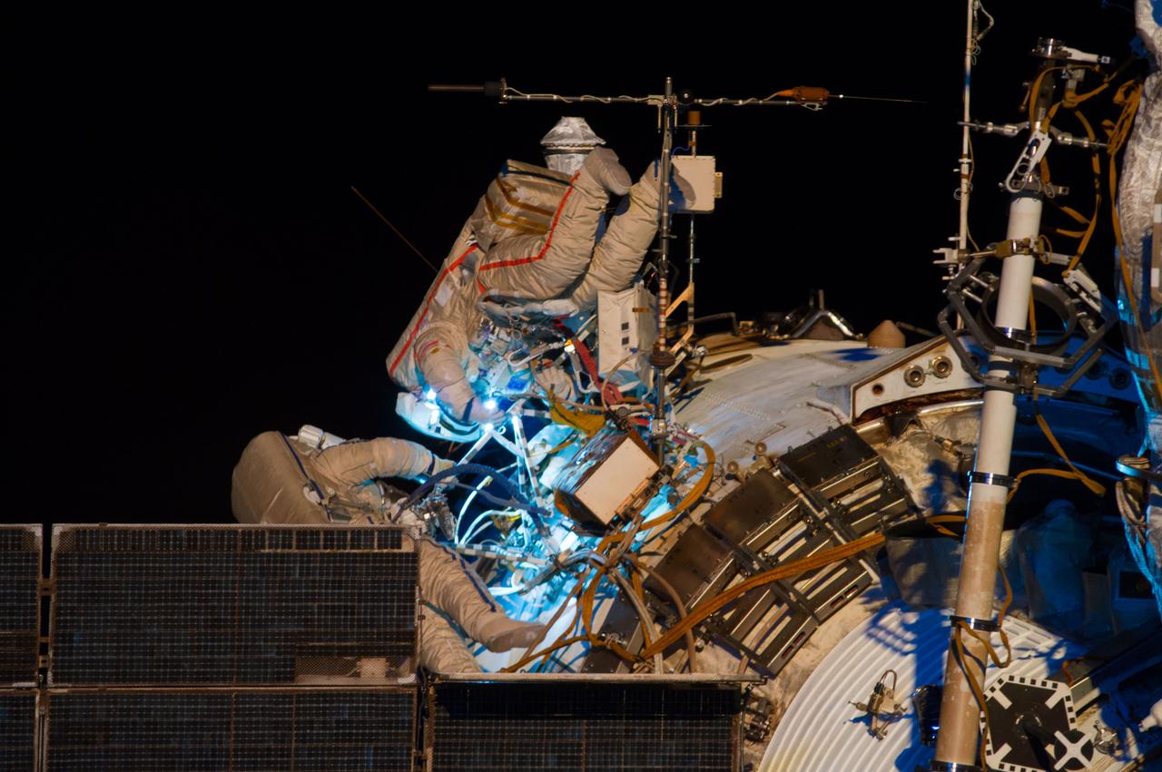 ISS040-E-015627 (19 June 2014) --- Russian cosmonauts Alexander Skvortsov (right) and Oleg Artemyev, both Expedition 40 flight engineers, participate in a session of extravehicular activity (EVA) as work continues on the International Space Station. During the seven-hour, 23-minute spacewalk Skvortsov and Artemyev completed installation and experiment tasks outside the station’s Russian segment.
