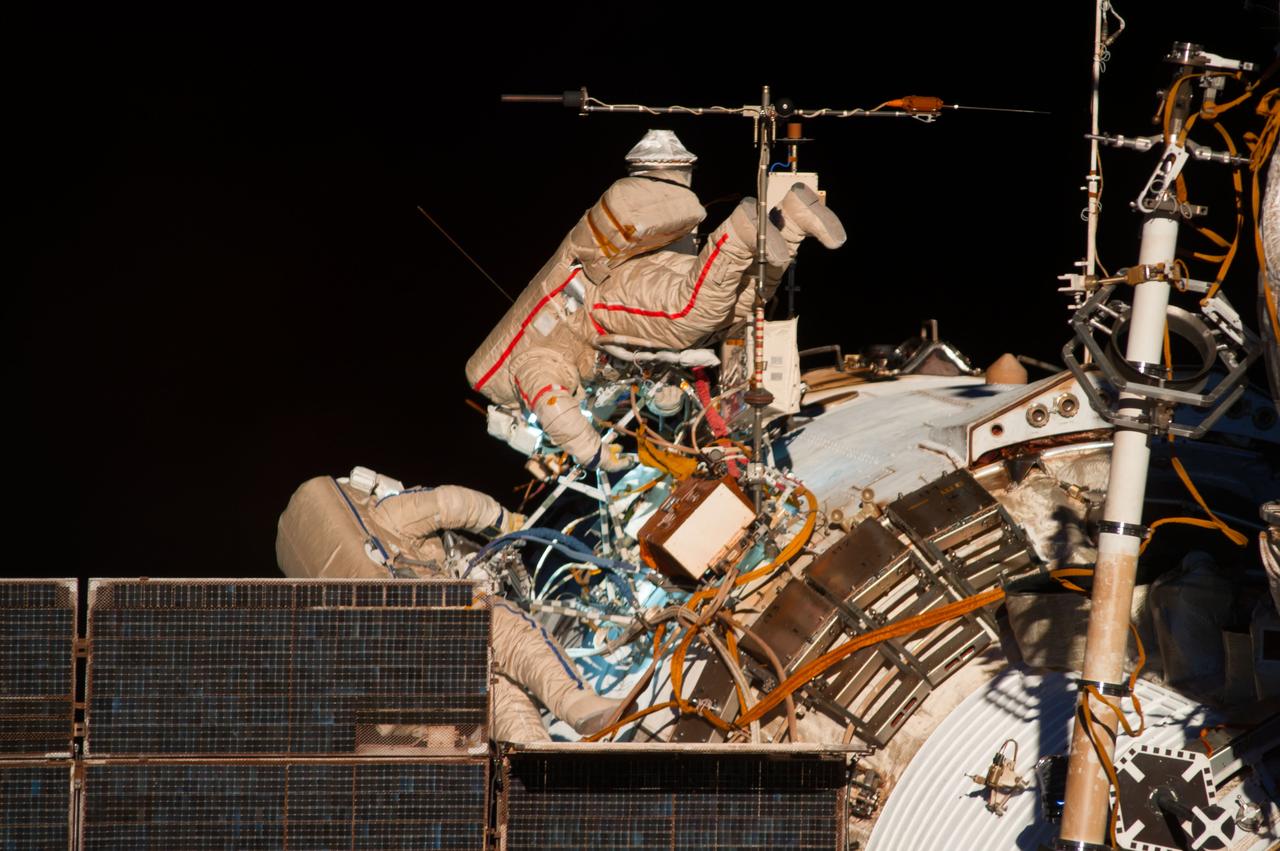 ISS040-E-015632 (19 June 2014) --- Russian cosmonauts Alexander Skvortsov (right) and Oleg Artemyev, both Expedition 40 flight engineers, participate in a session of extravehicular activity (EVA) as work continues on the International Space Station. During the seven-hour, 23-minute spacewalk Skvortsov and Artemyev completed installation and experiment tasks outside the station’s Russian segment.