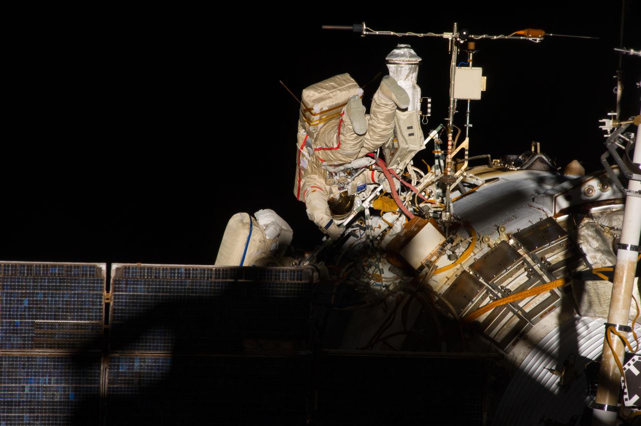 ISS040-E-015652 (19 June 2014) --- Russian cosmonauts Alexander Skvortsov (right) and Oleg Artemyev, both Expedition 40 flight engineers, participate in a session of extravehicular activity (EVA) as work continues on the International Space Station. During the seven-hour, 23-minute spacewalk Skvortsov and Artemyev completed installation and experiment tasks outside the station’s Russian segment.