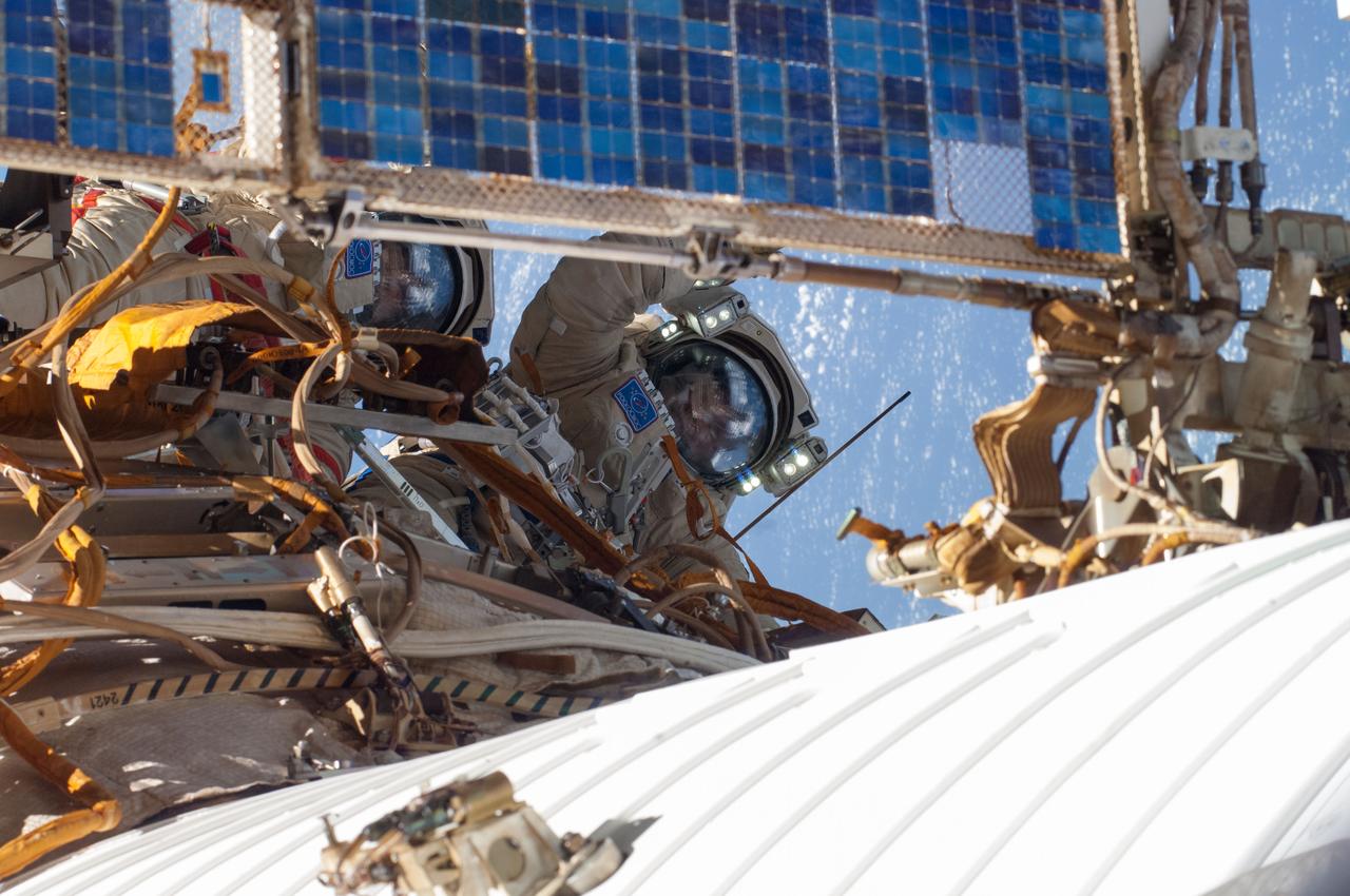 ISS040-E-015735 (19 June 2014) --- Russian cosmonauts Alexander Skvortsov (left) and Oleg Artemyev, both Expedition 40 flight engineers, participate in a session of extravehicular activity (EVA) as work continues on the International Space Station. During the seven-hour, 23-minute spacewalk Skvortsov and Artemyev completed installation and experiment tasks outside the station’s Russian segment.