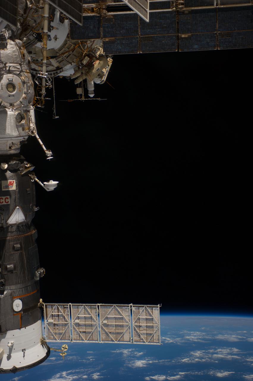 ISS040-E-015751 (19 June 2014) --- Russian cosmonauts Alexander Skvortsov (red stripes) and Oleg Artemyev, both Expedition 40 flight engineers, participate in a session of extravehicular activity (EVA) as work continues on the International Space Station. During the seven-hour, 23-minute spacewalk Skvortsov and Artemyev completed installation and experiment tasks outside the station’s Russian segment. The Progress 55 spacecraft, currently docked to the Pirs Docking Compartment, is at left.